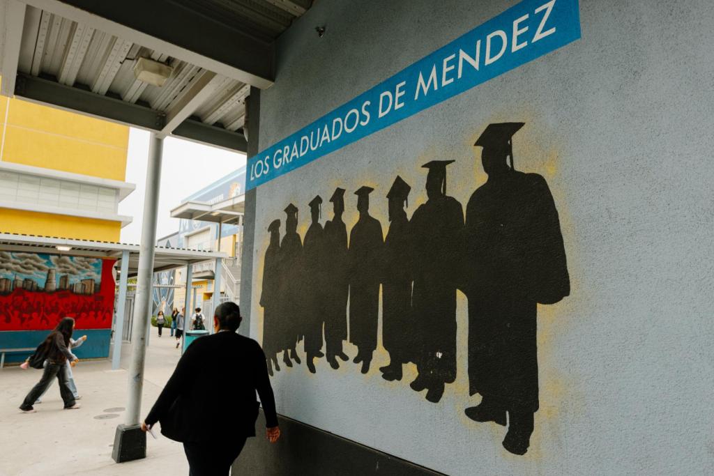 A mural celebrating graduates at Felicitas & Gonzalo Mendez High School.