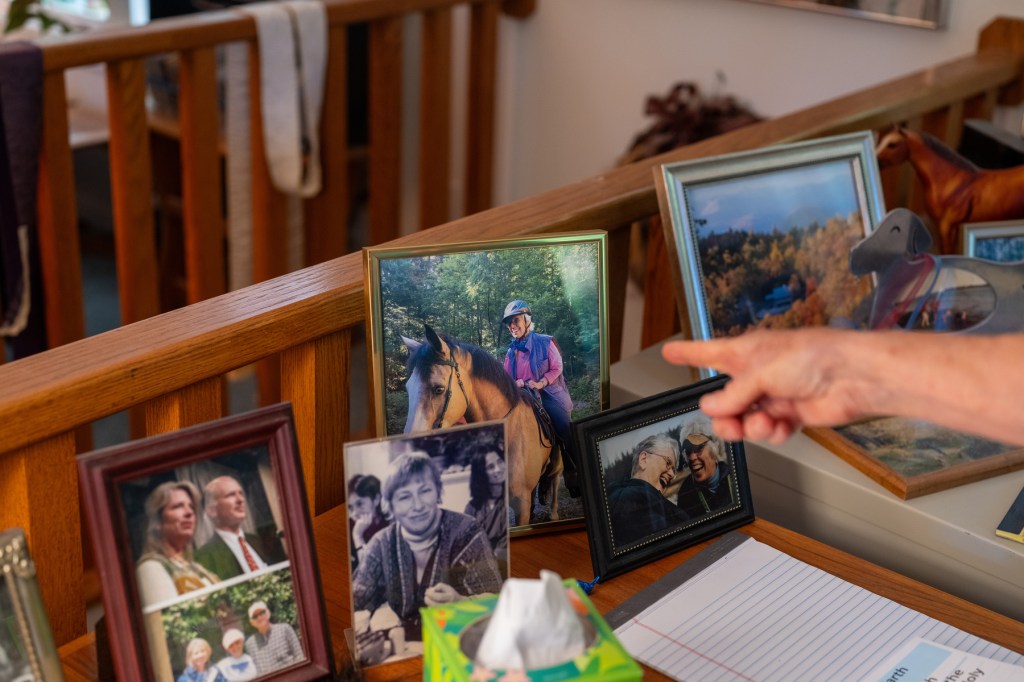 Photos sit on the desk of Rev. Carter Heyward.