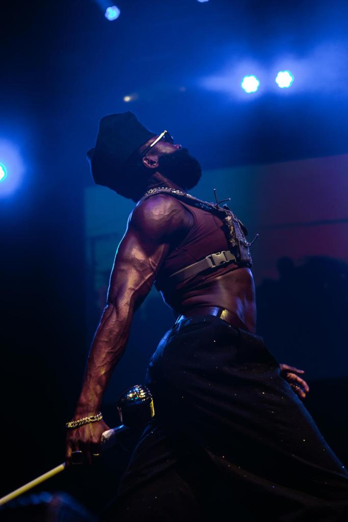 A person performs on stage.