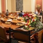 Dozens of roses remain on the desk of the late Rep. Melissa Hortman