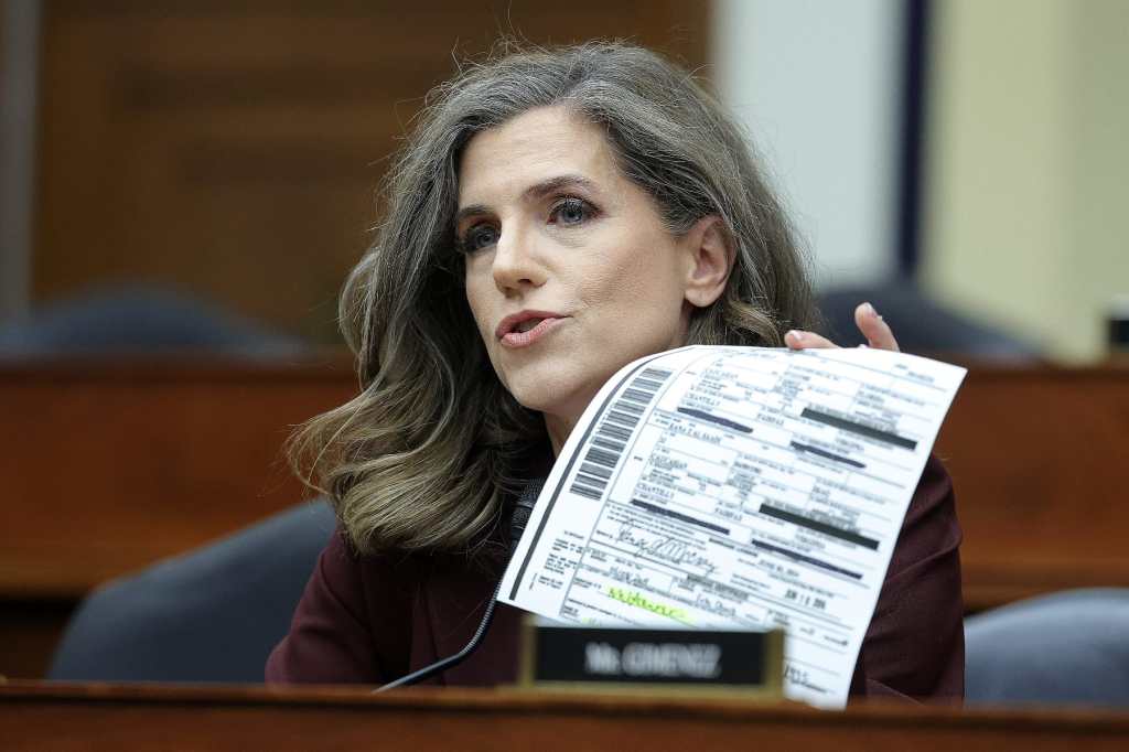 Nancy Mace holds a paper at a House committee hearing