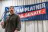 U.S. Senate candidate Graham Platner speaks in front of a sign with his name on it