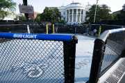 A UFC octagon with Bud Light advertisements on rails sits outside of the White House