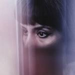 A woman's eyes in closeup looking off camera.
