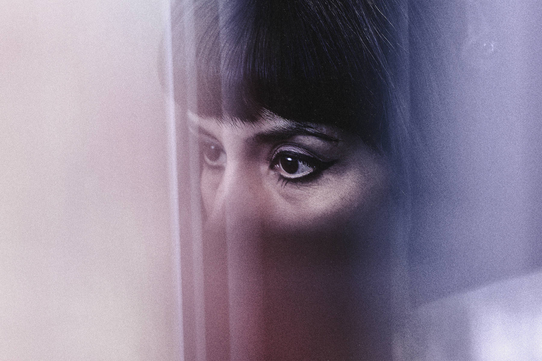 A woman's eyes in closeup looking off camera.