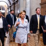 Sen. Darline Graham Nordone departs with staff and Capitol Police after being sworn in at the Capitol.