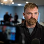 Senate candidate from Maine Graham Platner speaks during a television interview after a campaign event.