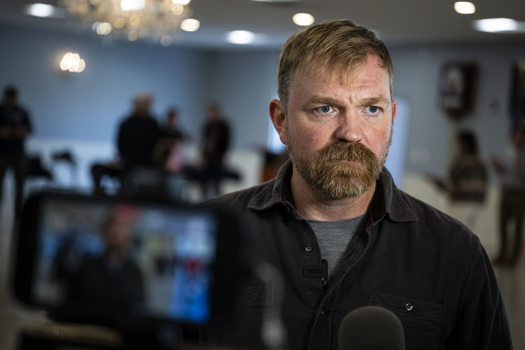 Senate candidate from Maine Graham Platner speaks during a television interview after a campaign event.