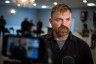 Senate candidate from Maine Graham Platner speaks during a television interview after a campaign event.