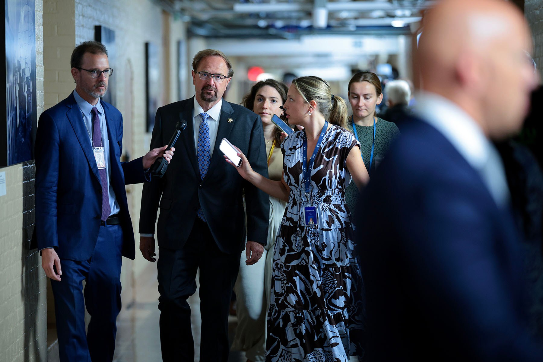Rep. Chuck Edwards talks to reporters as he arrives for a House Republican conference in the basement of the Capitol.