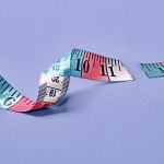An illustration of a tailor's measuring tape with a tear through it.