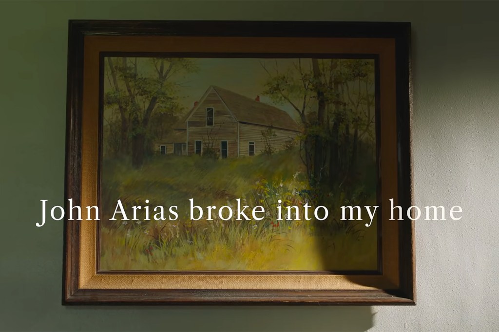 A framed painting of a house surrounded by trees hangs on a green wall. White text over the image reads, "John Arias broke into my home."