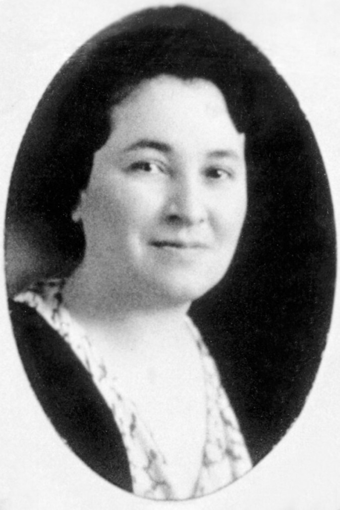 A black and white portrait of Akers